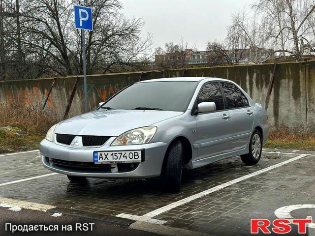 Сірий Міцубісі Lancer, об'ємом двигуна 1.6 л та пробігом 165 тис. км за 4000 $, фото 1 на Automoto.ua