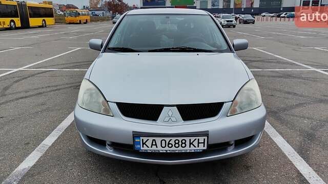 Серый Мицубиси Лансер, объемом двигателя 1.58 л и пробегом 216 тыс. км за 4700 $, фото 1 на Automoto.ua