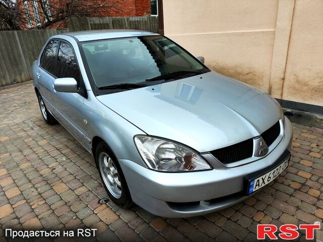 Серый Мицубиси Лансер, объемом двигателя 1.6 л и пробегом 185 тыс. км за 4700 $, фото 1 на Automoto.ua