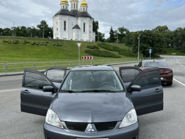 Серый Мицубиси Лансер, объемом двигателя 1.6 л и пробегом 235 тыс. км за 5500 $, фото 1 на Automoto.ua
