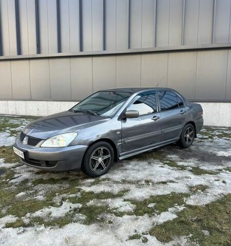 Серый Мицубиси Лансер, объемом двигателя 1.58 л и пробегом 320 тыс. км за 3300 $, фото 1 на Automoto.ua