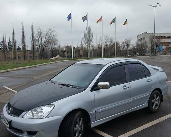 Сірий Міцубісі Lancer, об'ємом двигуна 1.6 л та пробігом 225 тис. км за 5200 $, фото 1 на Automoto.ua