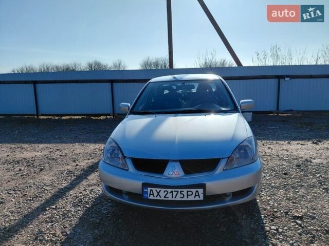 Серый Мицубиси Лансер, объемом двигателя 1.58 л и пробегом 185 тыс. км за 4300 $, фото 1 на Automoto.ua