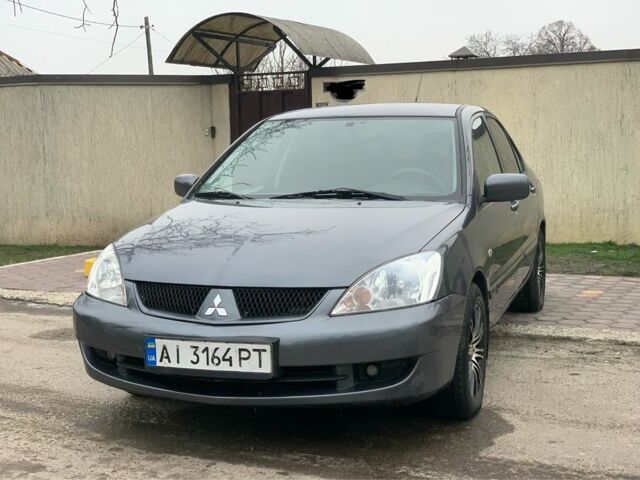 Серый Мицубиси Лансер, объемом двигателя 1.6 л и пробегом 180 тыс. км за 4700 $, фото 1 на Automoto.ua
