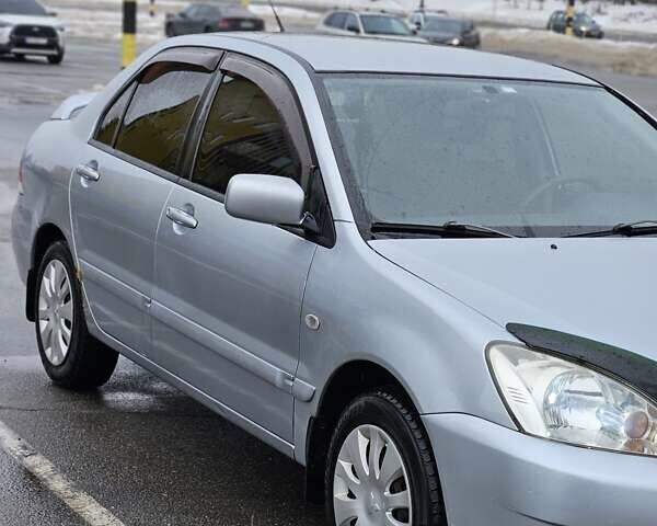 Серый Мицубиси Лансер, объемом двигателя 1.6 л и пробегом 140 тыс. км за 4900 $, фото 1 на Automoto.ua