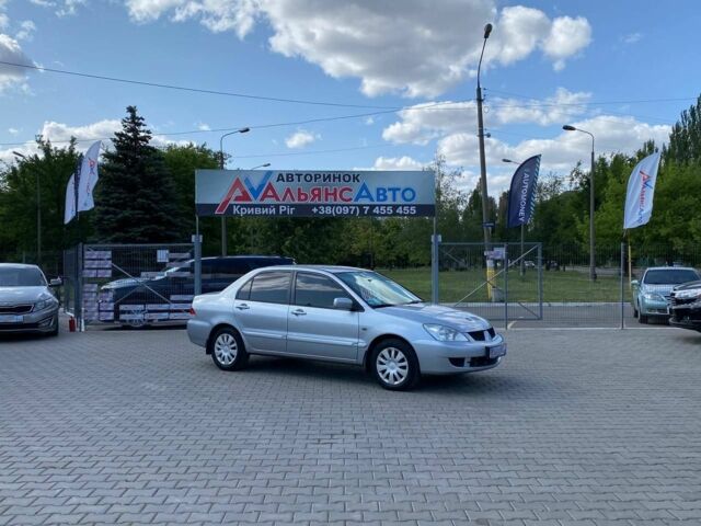 Серый Мицубиси Лансер, объемом двигателя 1.6 л и пробегом 190 тыс. км за 5300 $, фото 1 на Automoto.ua
