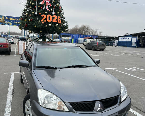 Серый Мицубиси Лансер, объемом двигателя 1.58 л и пробегом 183 тыс. км за 3800 $, фото 1 на Automoto.ua