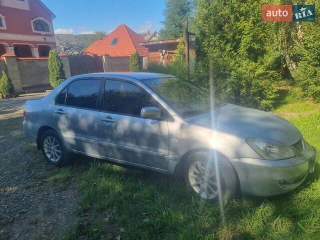 Сірий Міцубісі Lancer, об'ємом двигуна 1.6 л та пробігом 290 тис. км за 3850 $, фото 1 на Automoto.ua