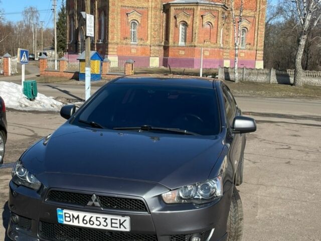 Серый Мицубиси Лансер, объемом двигателя 2 л и пробегом 247 тыс. км за 7000 $, фото 1 на Automoto.ua