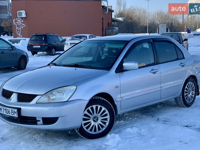 Серый Мицубиси Лансер, объемом двигателя 1.6 л и пробегом 204 тыс. км за 3899 $, фото 1 на Automoto.ua