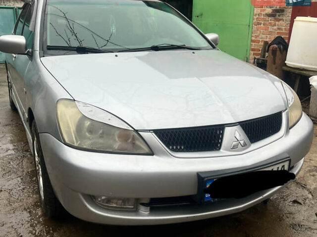 Серый Мицубиси Лансер, объемом двигателя 1.6 л и пробегом 282 тыс. км за 4699 $, фото 1 на Automoto.ua