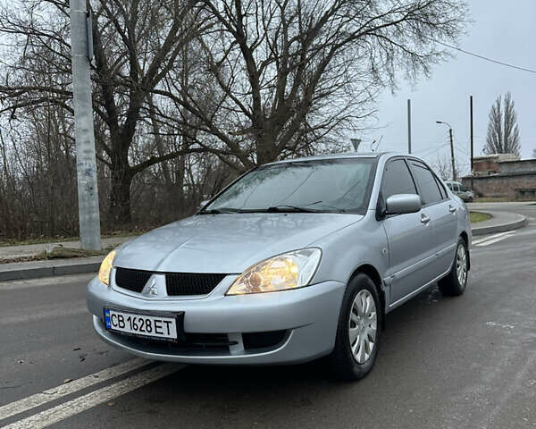 Сірий Міцубісі Lancer, об'ємом двигуна 1.58 л та пробігом 180 тис. км за 3900 $, фото 1 на Automoto.ua