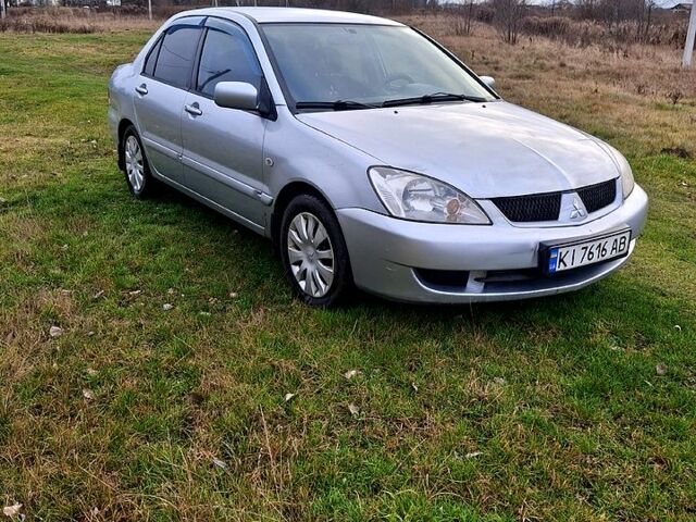 Серый Мицубиси Лансер, объемом двигателя 1.6 л и пробегом 36000 тыс. км за 4100 $, фото 1 на Automoto.ua