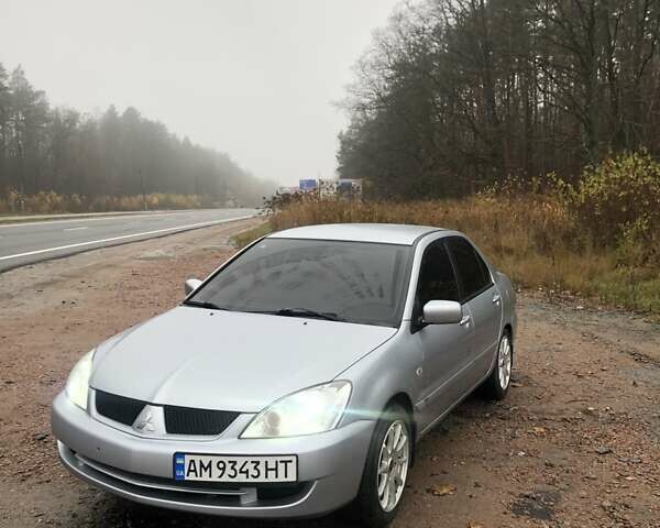 Серый Мицубиси Лансер, объемом двигателя 1.58 л и пробегом 268 тыс. км за 3450 $, фото 1 на Automoto.ua