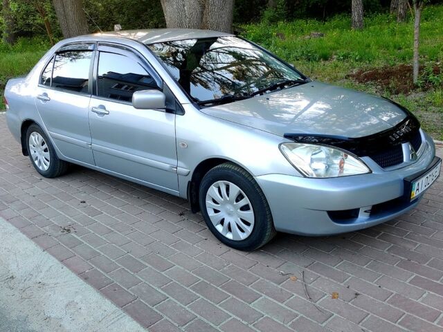 Сірий Міцубісі Lancer, об'ємом двигуна 1.6 л та пробігом 243 тис. км за 4600 $, фото 1 на Automoto.ua