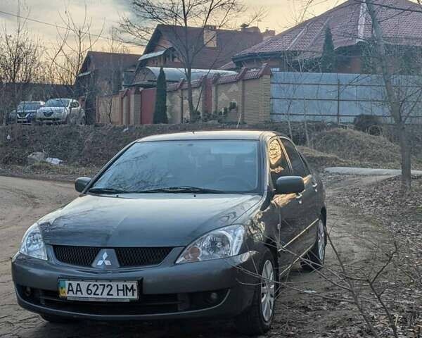 Серый Мицубиси Лансер, объемом двигателя 1.6 л и пробегом 129 тыс. км за 3500 $, фото 1 на Automoto.ua