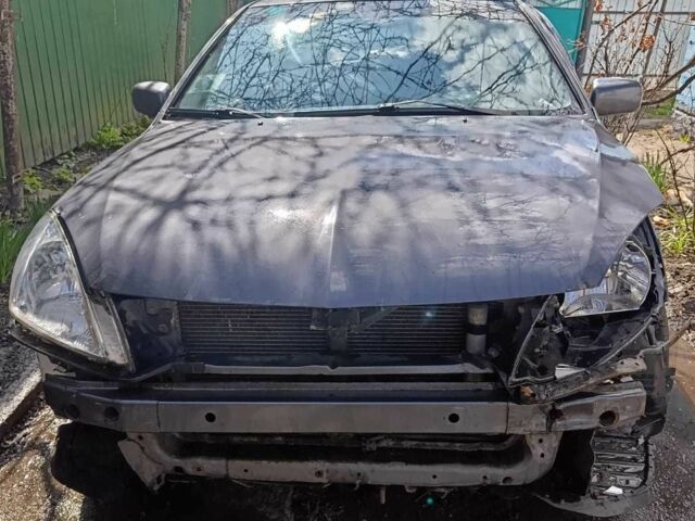 Сірий Міцубісі Lancer, об'ємом двигуна 1.6 л та пробігом 240 тис. км за 1300 $, фото 1 на Automoto.ua