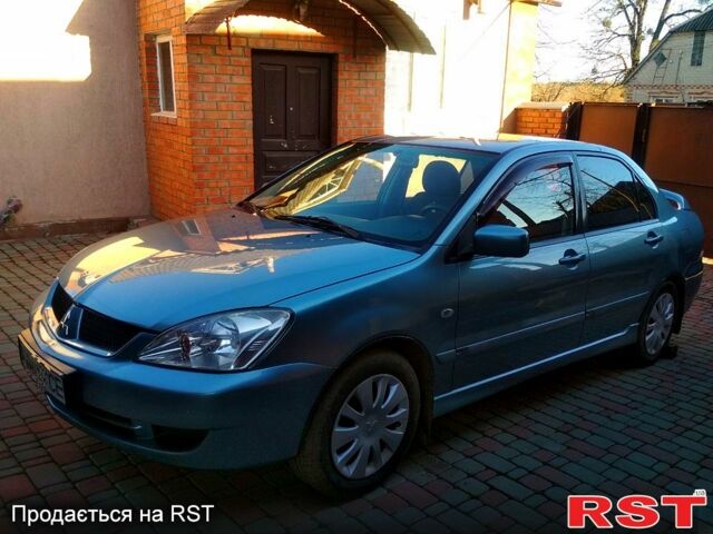 Серый Мицубиси Лансер, объемом двигателя 1.4 л и пробегом 200 тыс. км за 5700 $, фото 1 на Automoto.ua