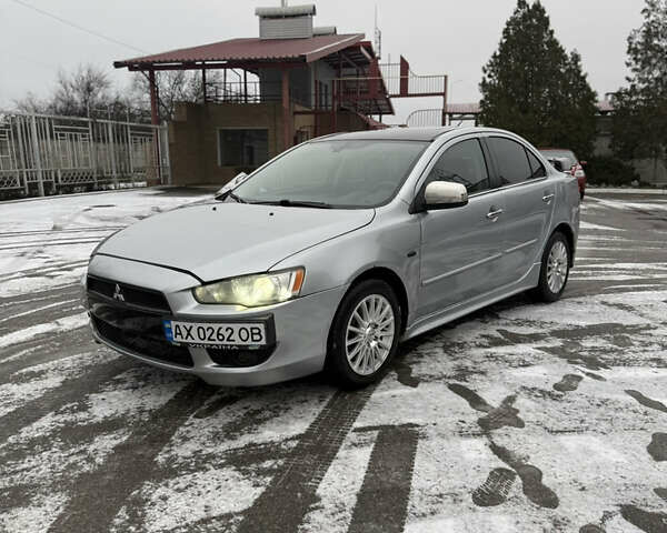 Серый Мицубиси Лансер, объемом двигателя 2 л и пробегом 238 тыс. км за 5800 $, фото 1 на Automoto.ua