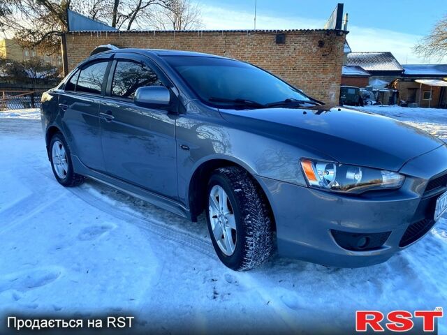 Серый Мицубиси Лансер, объемом двигателя 2 л и пробегом 18800 тыс. км за 6200 $, фото 1 на Automoto.ua