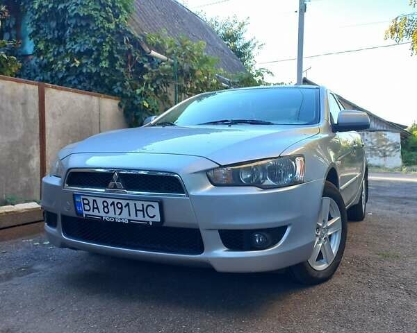 Серый Мицубиси Лансер, объемом двигателя 2 л и пробегом 103 тыс. км за 7700 $, фото 1 на Automoto.ua