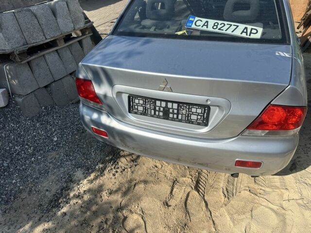 Серый Мицубиси Лансер, объемом двигателя 1.6 л и пробегом 260 тыс. км за 1200 $, фото 1 на Automoto.ua