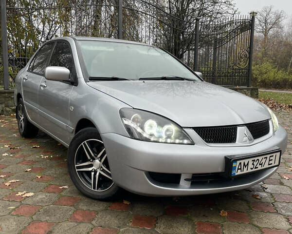 Сірий Міцубісі Lancer, об'ємом двигуна 1.59 л та пробігом 219 тис. км за 4500 $, фото 1 на Automoto.ua