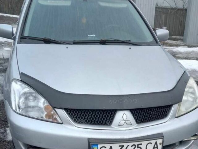 Серый Мицубиси Лансер, объемом двигателя 1.6 л и пробегом 205 тыс. км за 3650 $, фото 1 на Automoto.ua