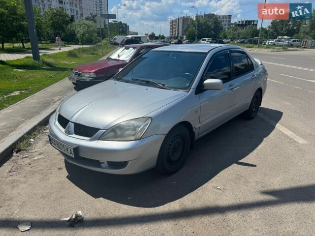 Серый Мицубиси Лансер, объемом двигателя 1.58 л и пробегом 320 тыс. км за 2950 $, фото 1 на Automoto.ua