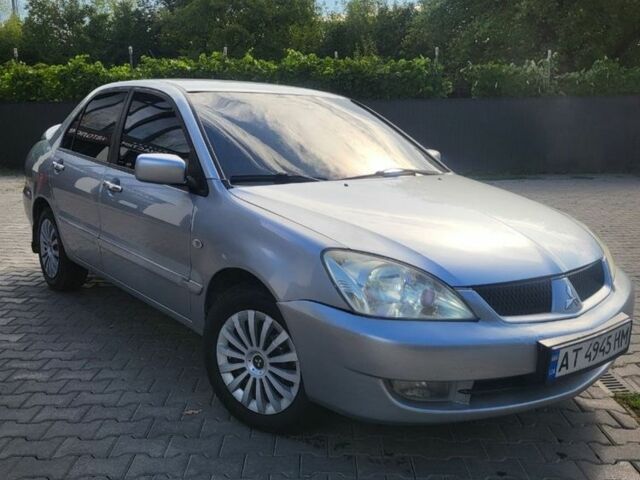 Серый Мицубиси Лансер, объемом двигателя 1.6 л и пробегом 170 тыс. км за 3494 $, фото 1 на Automoto.ua