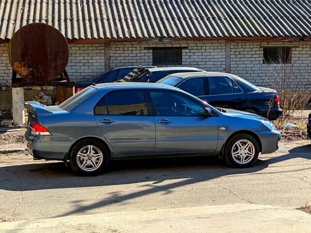 Сірий Міцубісі Lancer, об'ємом двигуна 1.6 л та пробігом 363 тис. км за 5000 $, фото 1 на Automoto.ua