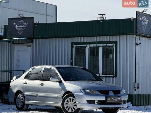 Серый Мицубиси Лансер, объемом двигателя 1.6 л и пробегом 258 тыс. км за 3790 $, фото 1 на Automoto.ua