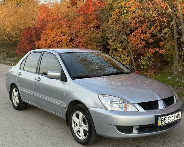 Серый Мицубиси Лансер, объемом двигателя 1.58 л и пробегом 145 тыс. км за 4800 $, фото 1 на Automoto.ua