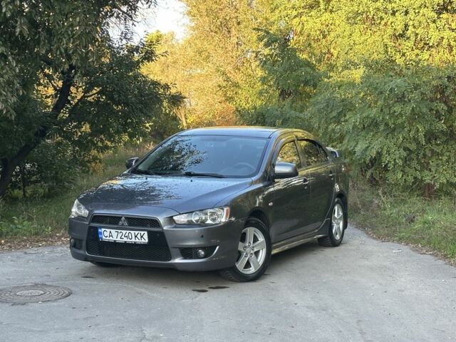 Серый Мицубиси Лансер, объемом двигателя 2 л и пробегом 153 тыс. км за 7500 $, фото 1 на Automoto.ua