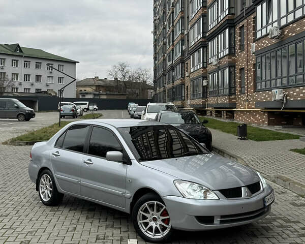 Сірий Міцубісі Lancer, об'ємом двигуна 1.6 л та пробігом 269 тис. км за 3999 $, фото 1 на Automoto.ua