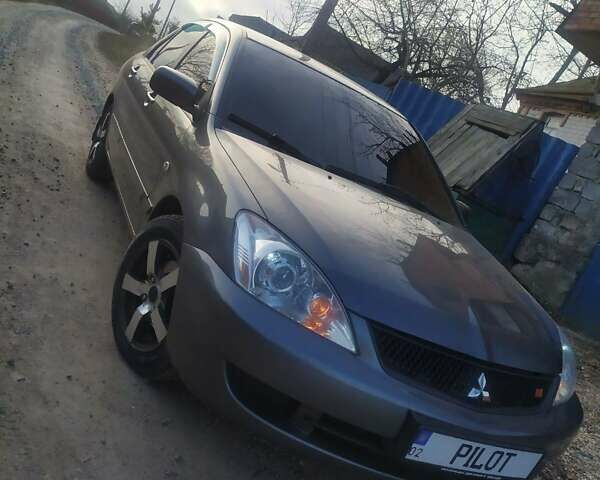 Серый Мицубиси Лансер, объемом двигателя 1.6 л и пробегом 187 тыс. км за 4900 $, фото 1 на Automoto.ua