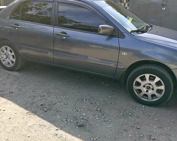 Сірий Міцубісі Lancer, об'ємом двигуна 1.58 л та пробігом 97 тис. км за 6800 $, фото 1 на Automoto.ua