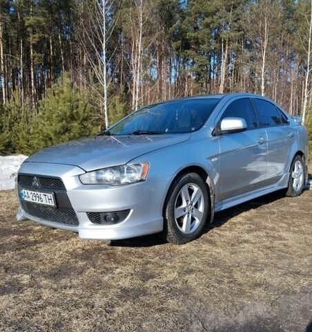 Серый Мицубиси Лансер, объемом двигателя 2 л и пробегом 312 тыс. км за 7000 $, фото 1 на Automoto.ua