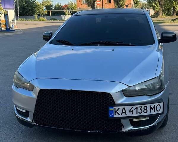 Серый Мицубиси Лансер, объемом двигателя 1.47 л и пробегом 200 тыс. км за 5000 $, фото 1 на Automoto.ua