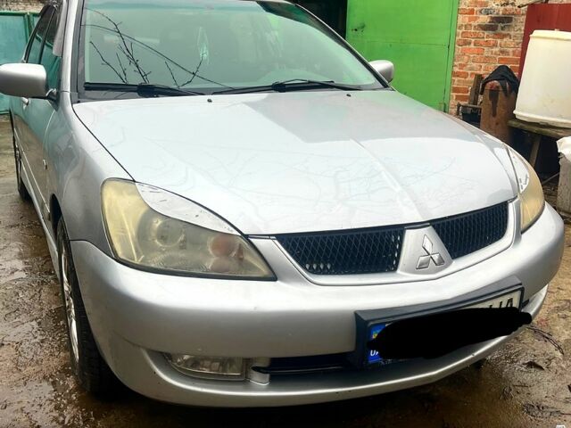 Сірий Міцубісі Lancer, об'ємом двигуна 1.6 л та пробігом 282 тис. км за 4699 $, фото 1 на Automoto.ua