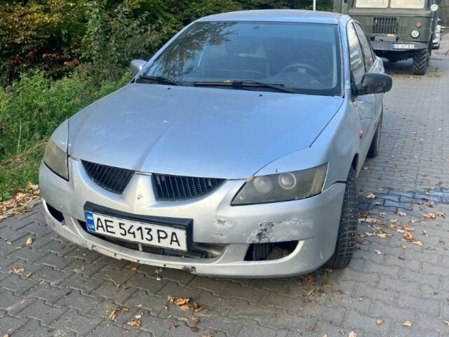 Серый Мицубиси Лансер, объемом двигателя 1.6 л и пробегом 140 тыс. км за 2500 $, фото 1 на Automoto.ua