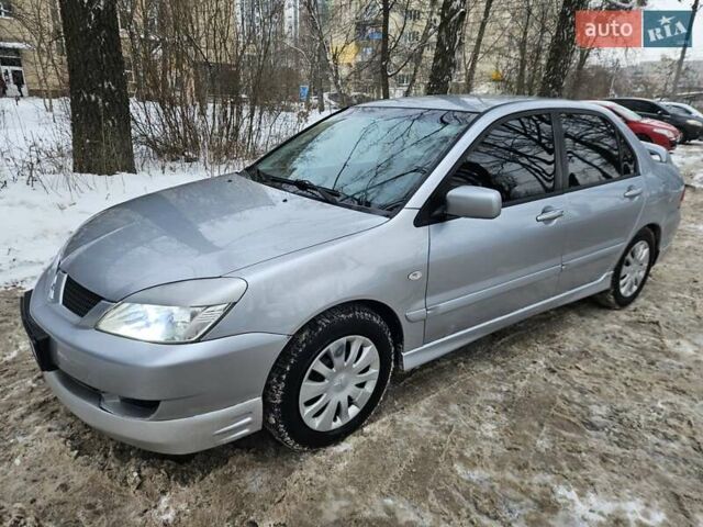 Серый Мицубиси Лансер, объемом двигателя 1.6 л и пробегом 255 тыс. км за 3800 $, фото 1 на Automoto.ua