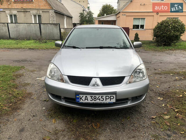 Сірий Міцубісі Lancer, об'ємом двигуна 1.58 л та пробігом 240 тис. км за 4299 $, фото 1 на Automoto.ua