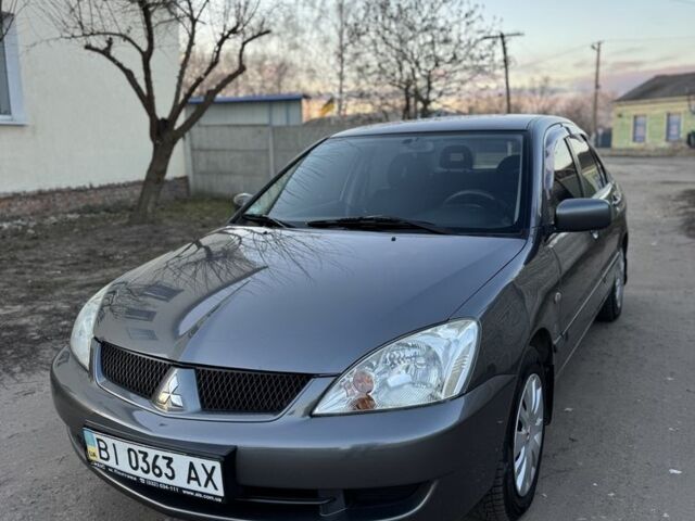 Серый Мицубиси Лансер, объемом двигателя 1.6 л и пробегом 225 тыс. км за 3350 $, фото 1 на Automoto.ua