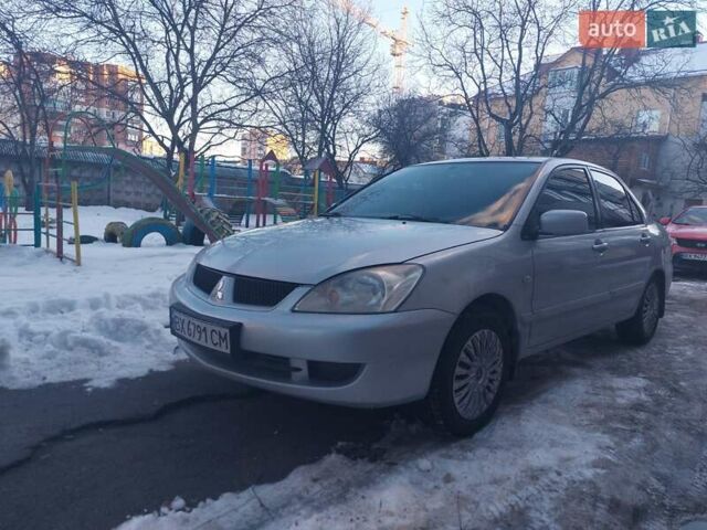 Серый Мицубиси Лансер, объемом двигателя 1.58 л и пробегом 196 тыс. км за 4300 $, фото 1 на Automoto.ua