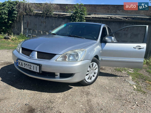 Сірий Міцубісі Lancer, об'ємом двигуна 1.6 л та пробігом 335 тис. км за 4100 $, фото 1 на Automoto.ua