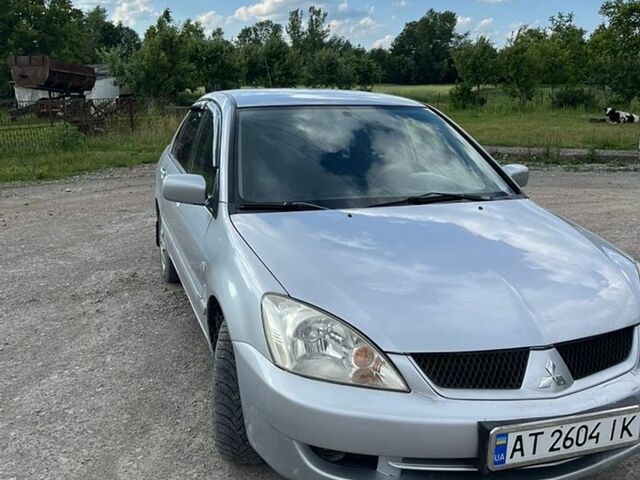 Серый Мицубиси Лансер, объемом двигателя 1.6 л и пробегом 270 тыс. км за 2500 $, фото 1 на Automoto.ua