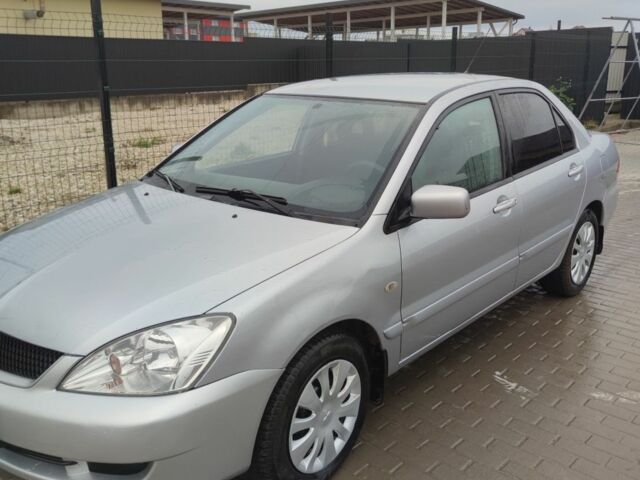 Серый Мицубиси Лансер, объемом двигателя 1.6 л и пробегом 225 тыс. км за 3100 $, фото 1 на Automoto.ua