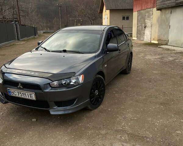 Серый Мицубиси Лансер, объемом двигателя 1.5 л и пробегом 220 тыс. км за 5200 $, фото 1 на Automoto.ua