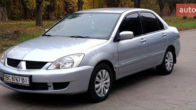 Серый Мицубиси Лансер, объемом двигателя 1.58 л и пробегом 176 тыс. км за 5000 $, фото 1 на Automoto.ua